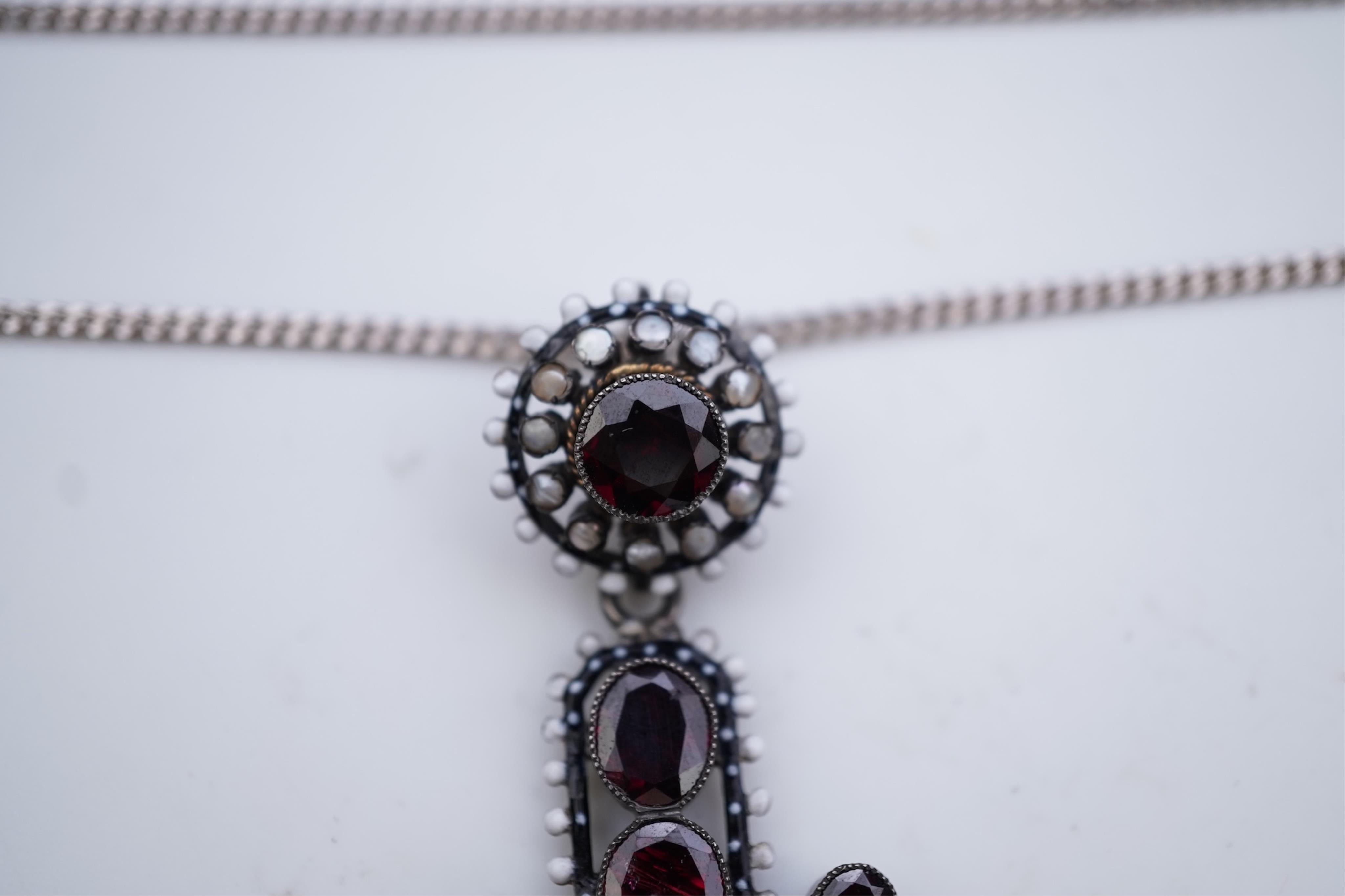 A Renaissance Revival enamel and garnet pendant, late 19th century